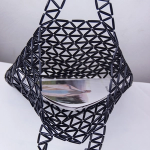 Handmade black acrylic beaded tote bag with hollow triangular weave design and large capacity