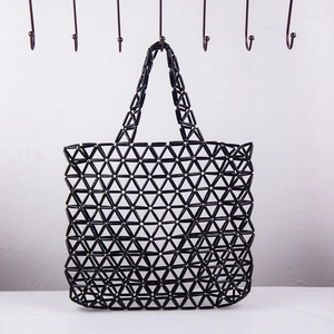Handmade black acrylic beaded tote bag with geometric hollow triangle pattern