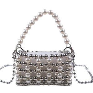 Elegant pearl and silver bead evening bag with mesh design and curved top handle