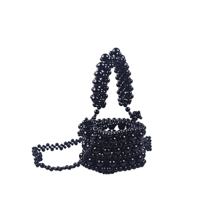 Handmade black acrylic beaded bucket bag with elegant top handle and crossbody strap