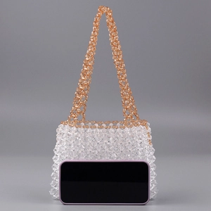 Handmade clear acrylic beaded tote bag with amber accents and smartphone for size reference