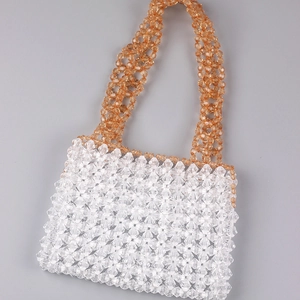 Handmade clear beaded tote bag with amber orange handle and woven acrylic beads