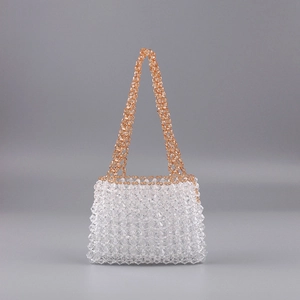 Detail of handmade clear and amber beaded trapezoid handbag with crystal facets