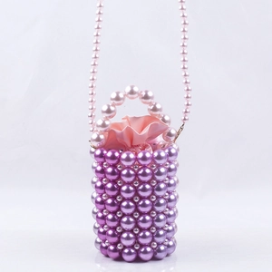 Detail of purple handmade beaded bucket bag with satin drawstring liner and pearl strap