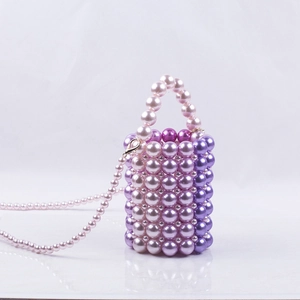 Handmade pink and purple pearl bucket bag with beaded top handle and detachable strap