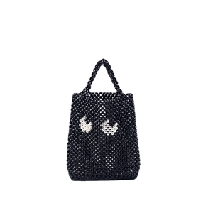 Sac à main fait main en perles noires avec motifs yeux blancs et poignée supérieure