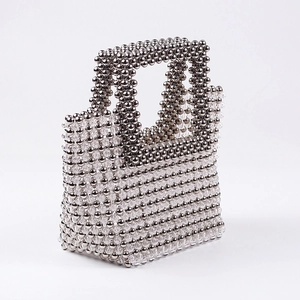 Handmade beaded evening handbag with translucent crystals and metallic texture beads