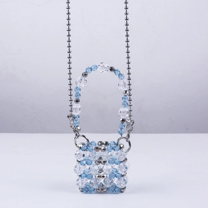 Handmade mini beaded crossbody bag with blue acrylic crystals and silver chain strap