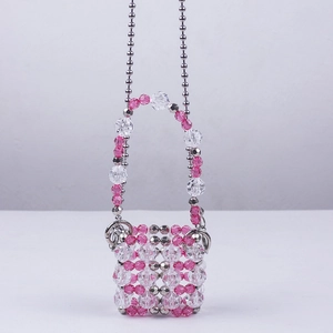Mini handmade acrylic beaded crossbody bag with pink and clear beads and silver chain strap