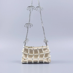 Handmade pearl and rhinestone lattice crossbody bag with elegant bow chain strap