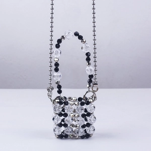 Mini handmade beaded handbag with clear and black beads and silver metal chain strap