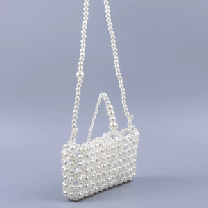 Elegant white pearl beaded crossbody bag with woven texture and top handle for women