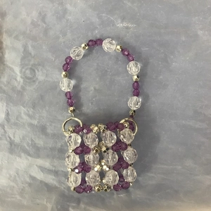 Handmade mini beaded crossbody bag with purple acrylic beads and golden metal rings