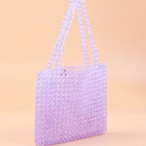 Detail showing handcrafted lavender acrylic beads and weave of this stylish tote bag