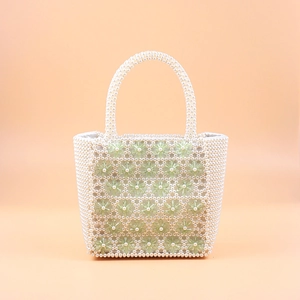 Handmade white pearl and green floral beaded handbag with a structured box shape