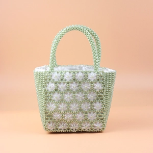 Handmade beaded green pearl handbag with floral accents and cream satin lining