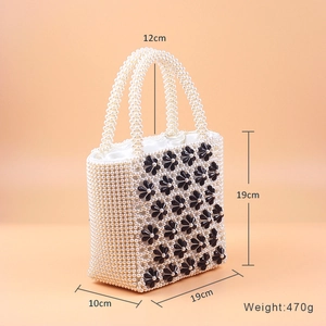 Detailed view of handmade pearl bag showing 19cm height and 10cm width dimensions