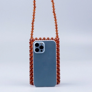 Handmade brown amber acrylic beaded crossbody phone bag with woven shoulder strap