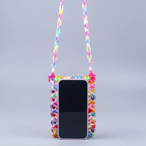 Detail of colorful acrylic heart-shaped beaded phone bag with rainbow chain strap