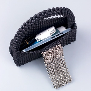 Fashionable black beaded handbag with silver bead fringe and spacious interior for daily use