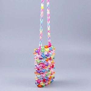 Detail view of handmade colorful acrylic heart-shaped beaded mini crossbody phone bag