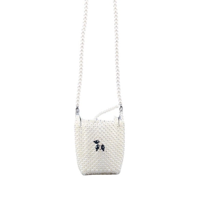 Handmade woven pearl crossbody bag featuring a black poodle bead design on white finish