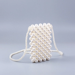 Detail of handcrafted white pearl crossbody phone bag with intricate woven texture