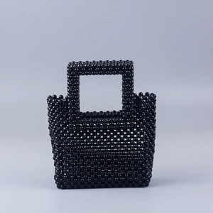 Handmade black beaded tote bag with rectangular design and top handle for trendy women