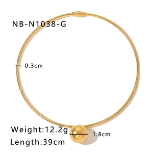 Macro view of 18k gold plated choker featuring a spiral collar and 1.8cm polished sphere