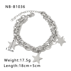 Detail view of double-layered Cuban chain bracelet with star charms and 5cm extension