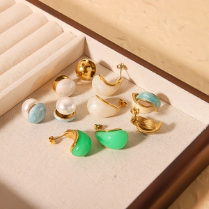 Golden 18k titanium steel earrings set with turquoise and pearls in a jewelry organizer