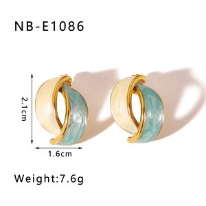 Detail showing 2.1cm teardrop gold earrings with turquoise enamel and wavy design
