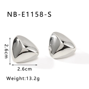 Detail view of 2.6cm minimalist 3D triangle stud earrings showing size and weight