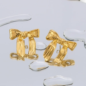 Élégantes boucles d'oreilles nœud papillon en or 18 carats avec texture métal brossé
