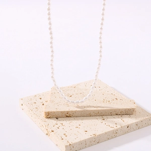 Minimalist 18k gold plated titanium steel necklace with elegant white rice pearls