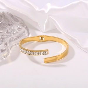 Luxury 18K gold plated titanium steel bangle with rectangular cubic zirconia accents