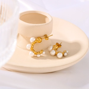 Elegant C-shaped stainless steel gold earrings with multiple white pearls