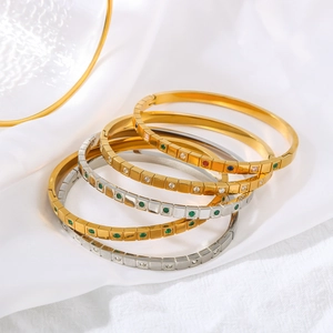 Polished titanium steel geometric bracelets with green zircon inlay and 18K gold plating