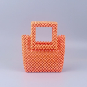 Sac à main en perles orange fait main avec structure rectangulaire et anse tressée