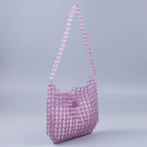 Detail of handmade lavender clear beaded bag showing intricate weave and top bead clasp