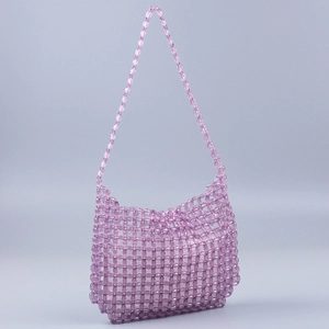Macro detail of hand-woven purple acrylic beads and structure of the beaded handbag