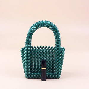 Handmade dark green beaded mini pearl handbag with glossy finish for evening parties