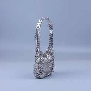 Silver sequin mesh hobo bag featuring futuristic metal chainmail and crescent moon shape