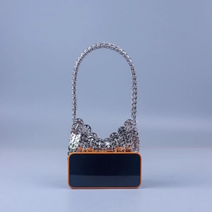 Handmade silver sequin handbag with metallic chain link design and woven handle