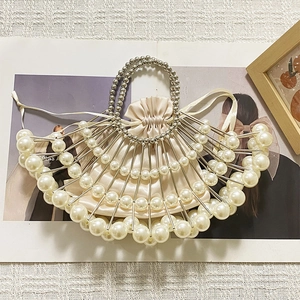 Detailed fan-shaped pearl evening clutch with champagne satin pouch and metal bead handle