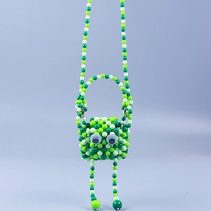 Mini-Handtasche aus grünen Perlen im Monster-Design mit handgefertigten Details und Augen