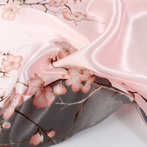 Light pink satin silk scarf with cherry blossom floral prints and soft silk texture