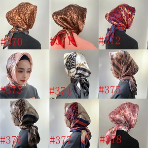 Macro display of nine vintage satin headscarf patterns with classic luxury prints