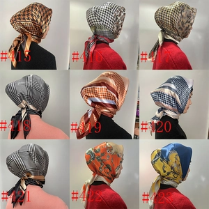 Grid view showing nine varied satin head scarves with houndstooth and vintage chain prints