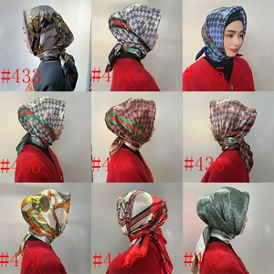Polka dot satin square scarf detail showing various vintage luxury patterns and styles